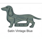 Satin vintage blue dog-shaped key holder on a white background