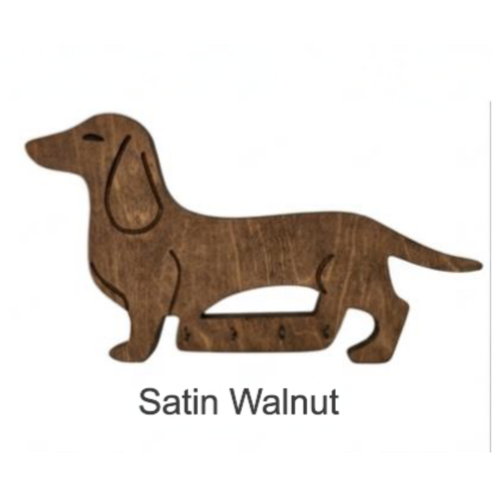 Wooden dachshund shape cutout in satin walnut finish on a white background